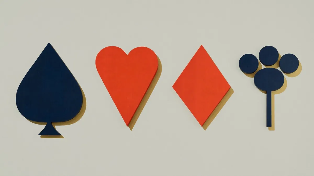 Flat spade, heart, diamond and club shapes in navy and vermilion