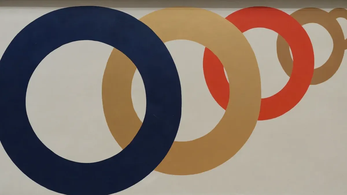 Interlocking navy, brass and vermilion rings receding into depth